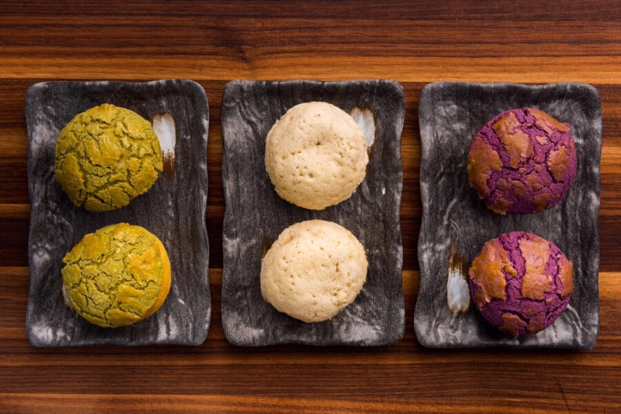 Three colorful baos — the kind of visually striking dish Bay Area restaurants use to earn non-follower reach on Instagram Reels — served at Palette Tea House in San Francisco's Ghirardelli Square.