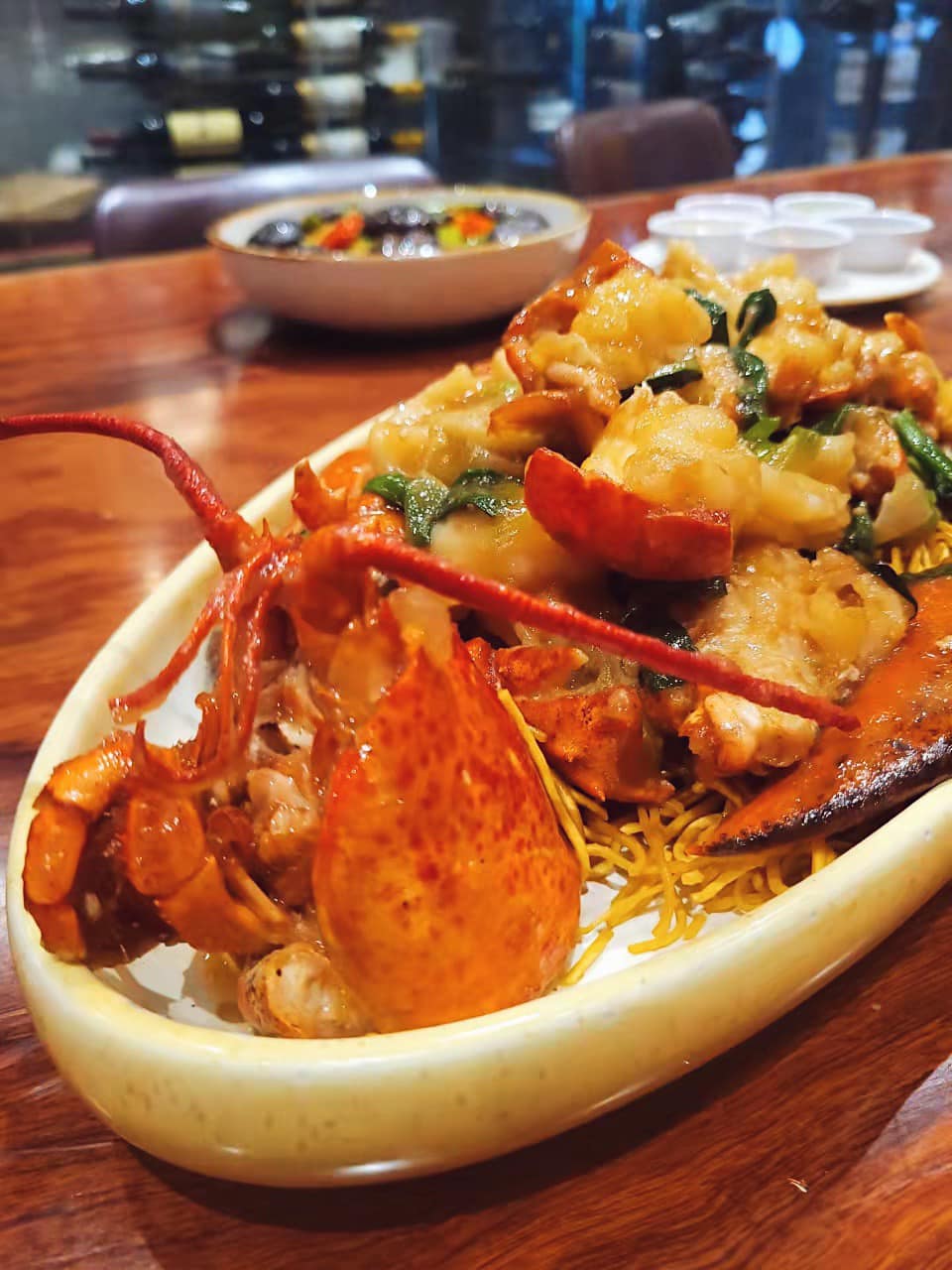 Vibrant Hong Kong-style lobster yifu noodles plated at a San Francisco Bay Area Chinese restaurant — the kind of hero photo that turns a Google Business Profile search into a reservation.