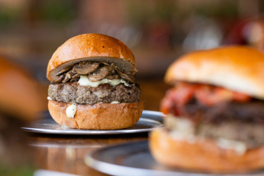 A juicy mushroom-and-truffle-aioli burger on a toasted brioche bun at a Bay Area restaurant — the kind of crave-worthy dish diners screenshot and send straight to a friend's DMs.